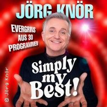 Ein Mann vor einem roten Hintergrund mit dem Text 'Jörg Knör - Simply my Best!'