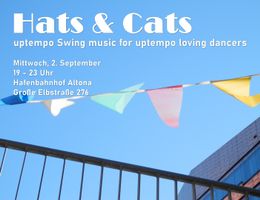 Einladung zu einem Swing-Musik-Event mit bunten Wimpeln vor blauem Himmel.